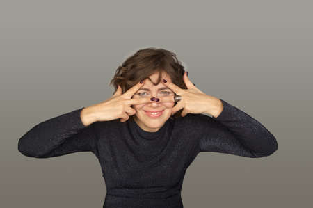 Cute woman making faces. Mimic and facial expressions.の写真素材