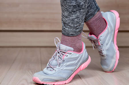 Fit female leg in sport shoe stepの写真素材