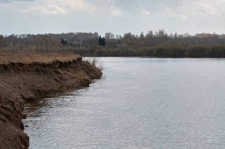 Early spring landscape with a lake.