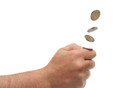Making choice: hand throwing up a coin, isolated on white background with clipping path.の写真素材