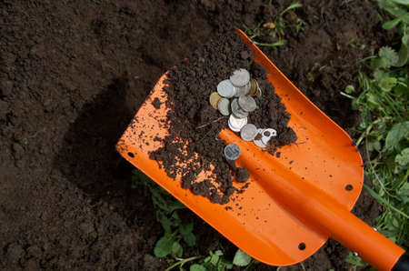 Coins dug out of the ground. concept of treasure findingの写真素材