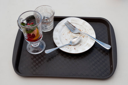 Dirty plates on the table after meal in the restaurant or cafe.の写真素材