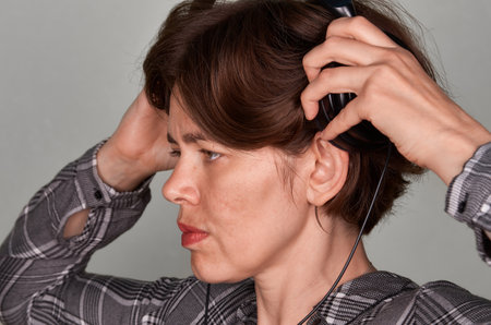 Close up portrait of pensive woman in headphones