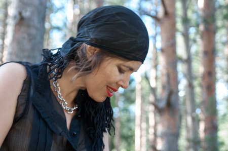 Woman in casual clothes rides a horse in early springの写真素材