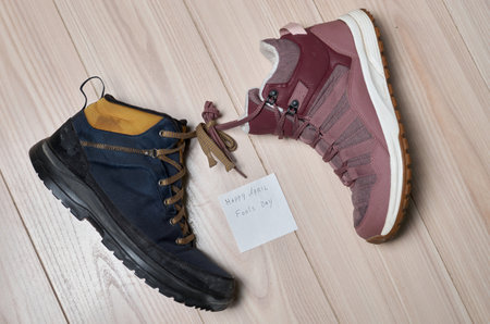 April Fool's Draw. Two different boots with tied laces