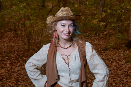 Dancing woman in bright autumn parkの写真素材