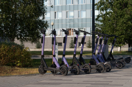 Parking of electric scooters on the street of a modern cityの写真素材