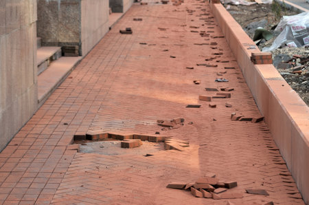 Laying paving slabs on a sidewalk being repairedの写真素材