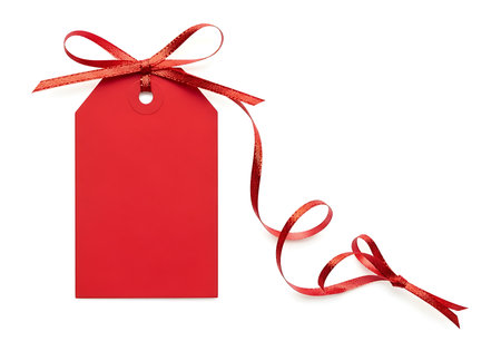 A vibrant red gift tag is presented, neatly tied with a decorative ribbon. This festive element is perfect for adding a personal touch to any present or special occasion.の素材