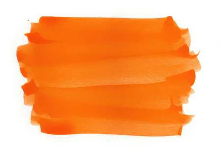 An orange watercolor brush stroke with a textured look, painted on a white surface. The design element is artistic, creating a vibrant and abstract background for various creative projects.の素材