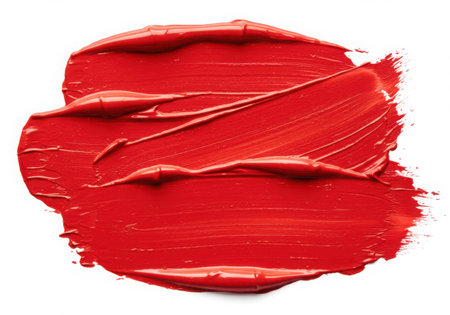 A vibrant red paint stroke with a visible texture, isolated on a white background. The thick paint creates a bold and artistic smear, perfect for adding a pop of color to any design.の素材