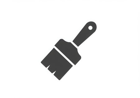 A gray paint brush icon with a handle and bristles, isolated on a white background. The brush is simple, clean, and suitable for representing painting, art, or home improvement concepts.の素材