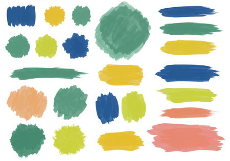 A collection of watercolor brush strokes and spots in various colors such as blue, green, yellow, and orange. The strokes and spots are isolated on a white background, creating a clean and modern aesthetic.の素材