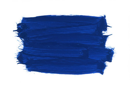 A blue paint brush stroke with a textured surface. The brush stroke is isolated on a white background, showcasing the color and texture of the paint. It can be used for artistic designs.の素材
