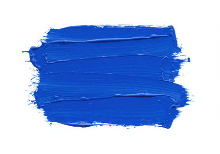 A vibrant blue paint stroke with visible brush texture, isolated on a clean white background. The smear of color creates an artistic element, perfect for design and creative projects.の素材