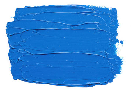 A vibrant blue paint stroke with visible texture, applied with a brush. The thick application of paint creates a dynamic surface, perfect for artistic backgrounds and design elements. Isolated on white.の素材