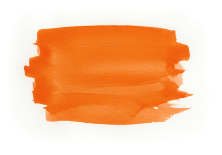 An orange watercolor brush stroke on a white background. This artistic element adds a vibrant touch, perfect for graphic design and creative projects. The texture provides an abstract feel.の素材