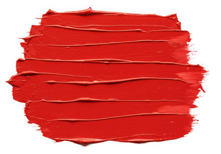 A vibrant red paint stroke with visible texture. The thick, layered application creates a dynamic and artistic effect. Perfect for adding a bold splash of color to any design project.の素材