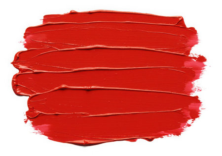 Close-up of vibrant red paint strokes on a white backdrop. The texture is thick and glossy, creating a bold and artistic effect. Perfect for design projects seeking a splash of color and creativity.の素材