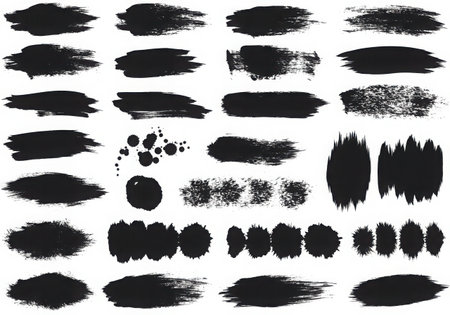 A set of black brush strokes and splatters. Perfect for adding a touch of grunge or artistic flair to your designs. Use them as design elements, backgrounds, or textures to create unique and eye-catching compositions.の素材