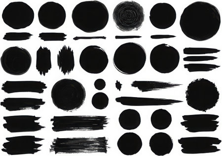 A collection of black ink elements, including circles and brush strokes, are displayed. These artistic shapes and textures create a visually interesting composition, perfect for design projects.の素材