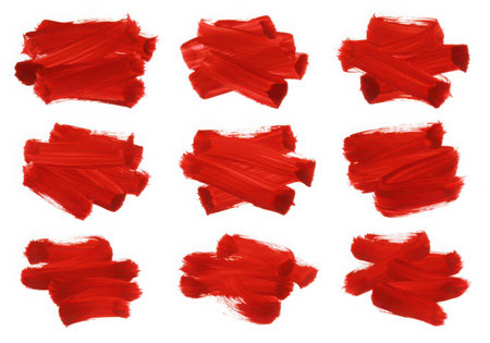 A collection of nine red paint strokes arranged in a grid pattern. Each stroke has a unique texture and shape, creating an artistic and abstract design element on a clean, white background. Perfect for adding a vibrant touch.の素材