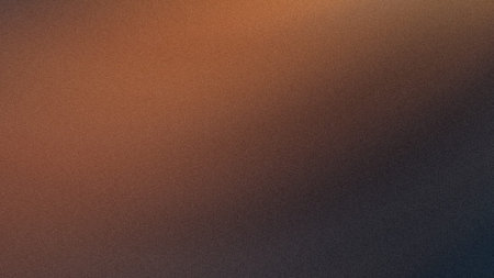 The image depicts a textured surface with a gradient that transitions from orange at the top left to...