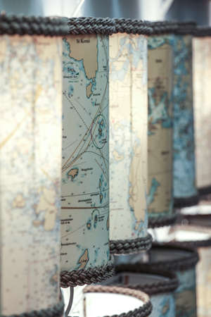 Vintage map turned into lamp photophore with rope at both endsの写真素材