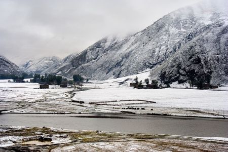 Snow view of tibetan village at Shangri-la Chinaの写真素材