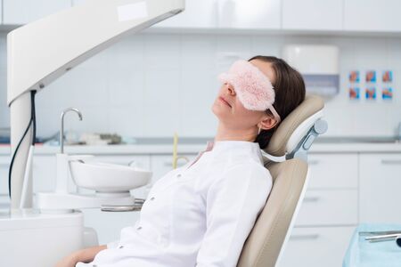 A doctor is having a break while there are no patientsの写真素材