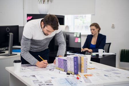 Two colleagues, employees working in the architect office