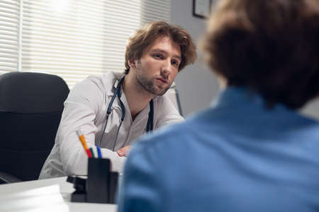 Healthcare and medicine concept - a doctor with his patient in a consultation roomの写真素材