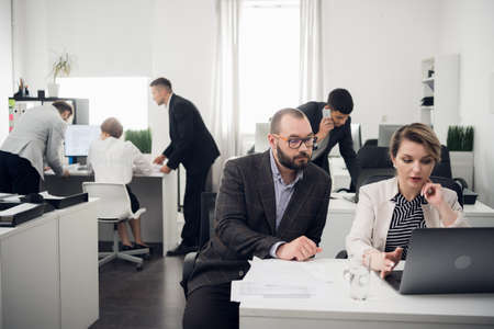 Communication for making a deal with a client of a financial company in the office at the table. Sales Manager and buyerの写真素材