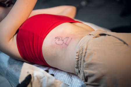 After the work done, the tattoo master processes the clients skin to heal faster.