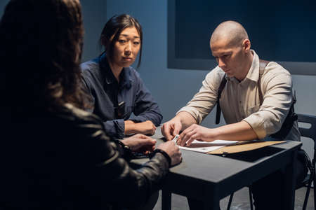 The investigator conducts an interrogation, shows the suspect photos of accomplices.