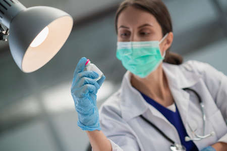 In the medical clinic, vaccination of the population against covid-19 has begun, the doctor shows a...