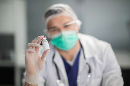 vaccine close-up in the hands of a doctor.の写真素材