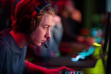 A cute gamer plays an online game, worries about his teammates
