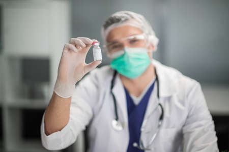 Covid-19 coronavirus vaccine close-up in the hands of a doctor