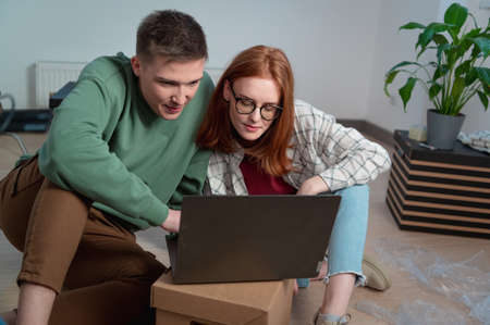 A young couple moves into a new apartment and picks up the design of their future kitchen on the...