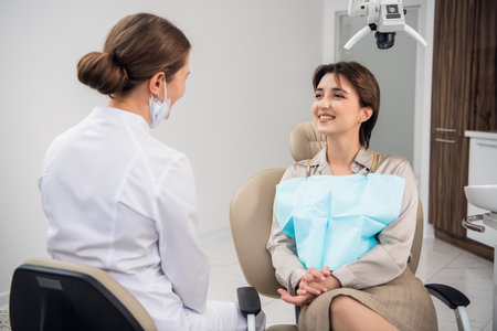 Closeup portrait of a smiling happy patient in dentistry office. Clinic visit, preventive medical annual check up. Positive facial expressionの写真素材
