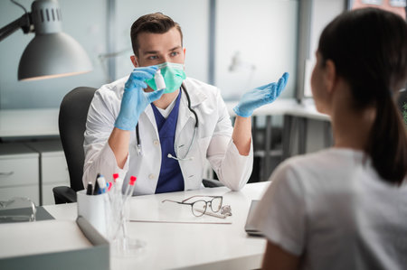 An experienced therapist offers to get vaccinated with a new coronavirus vaccine to his patientの写真素材