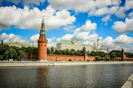 View of the towers of the Moscow Kremlin from the embankment of the Moscow river on the background of beautiful blue sky with clouds.のeditorial素材