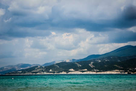 Low clouds on the background of sea and mountains.の写真素材