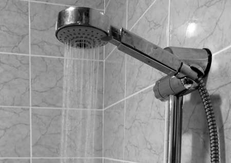 From the shower head under high pressure is running waterの写真素材