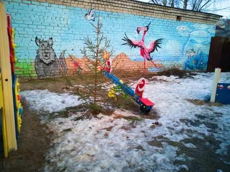 Graffiti on the wall of a children's Playground in the yard of a house.
