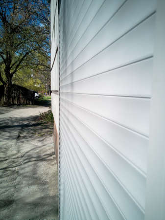 Closed shutters entrance to the room from the streetの写真素材