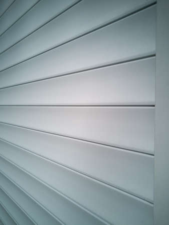 Beautiful view of the door closed with shutters. The view from the side. Beautiful structure.の写真素材