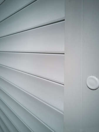 Side view of the door closed with shutters. Beautiful structure.