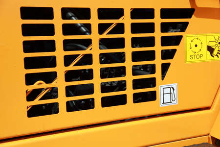 Orange grille of the new tractors engine compartment.の写真素材